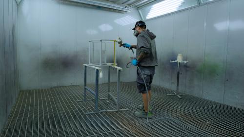 Our painters work on custom-designed furniture and stand elements in our own paint booth, using individually mixed colors.